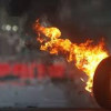 Возле Кабмина жгли шины, одного мужчину задержали, двух разыскивают