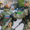 В Луганске террористы, нацепив флаги Украины, обстреливают жилье мирных жителей