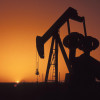 Нефть держится ниже $ 60 за баррель